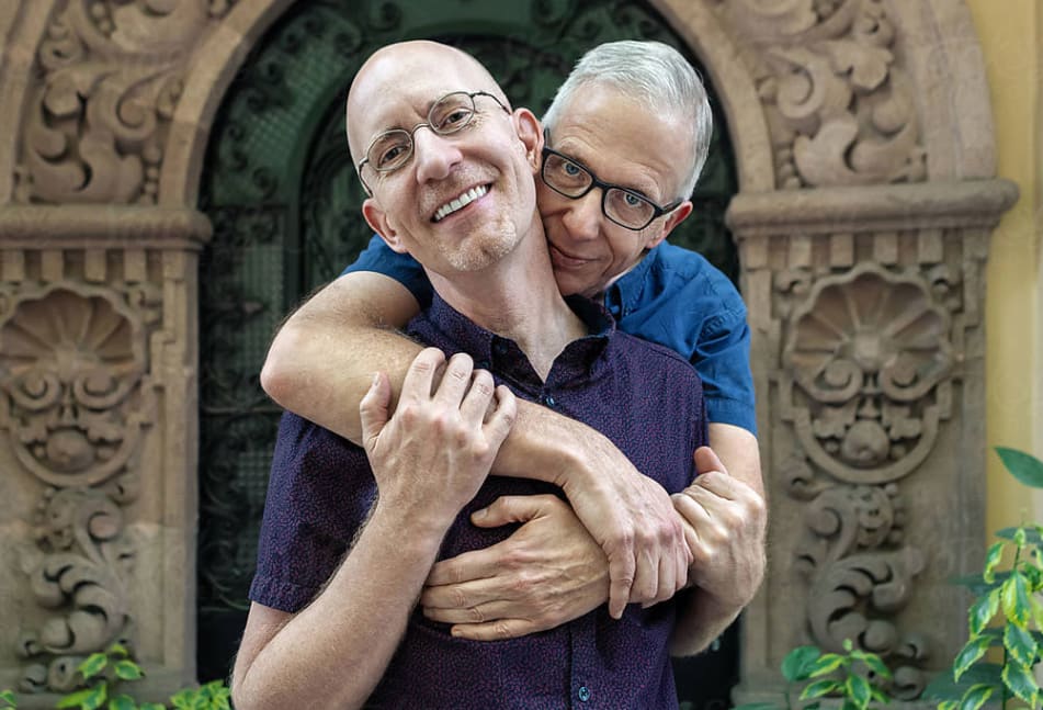 Two men hugging each other in support